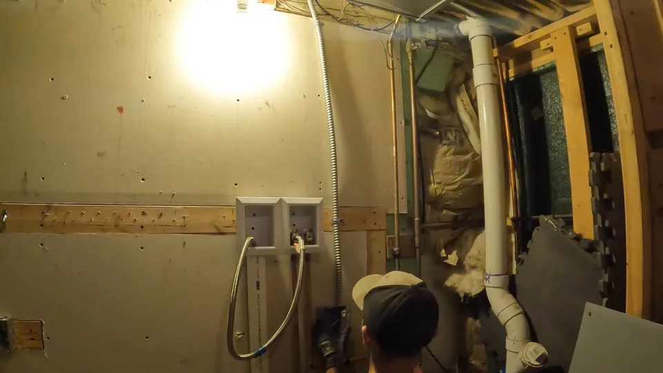 Basement rough-in, utility sink, or exposed piping for Sump pump and battery backup installed in a Stroh Ranch basement