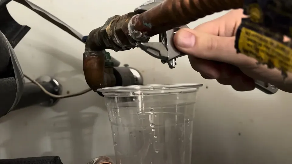 Tank water heater and plumbing connections for Water heater replacement in a Saddlebrook Parker home utility room