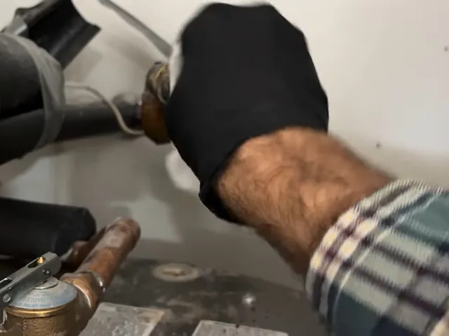 Tank water heater and plumbing connections for Stonegate